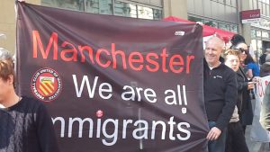 banner at demonstration in Manchester